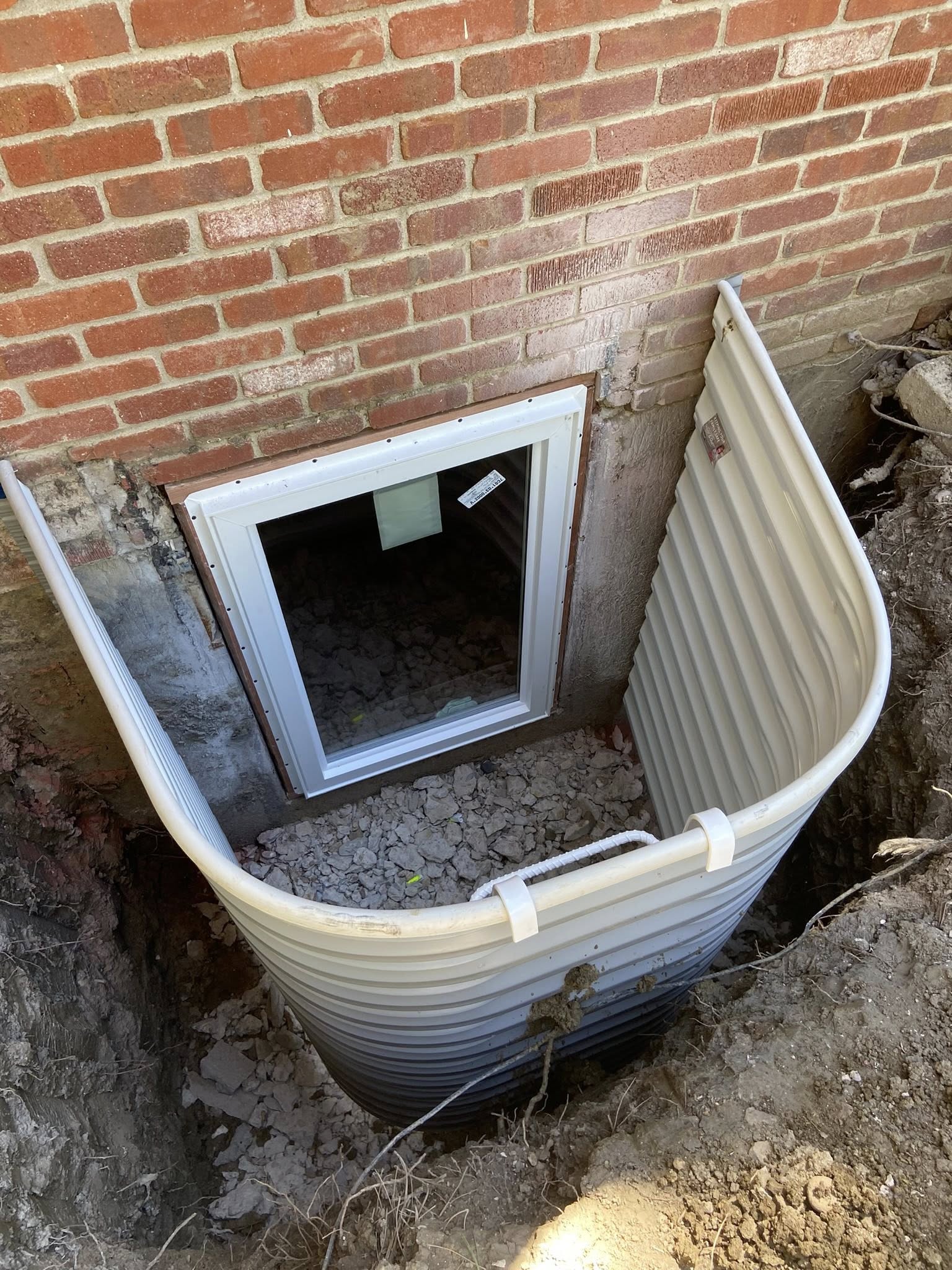 Denver egress window project by Vasquez Remodel LLC